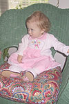 Jolie liked sitting on Mary's chairs like a big girl.