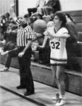 The ref waves to his wife in the stands.